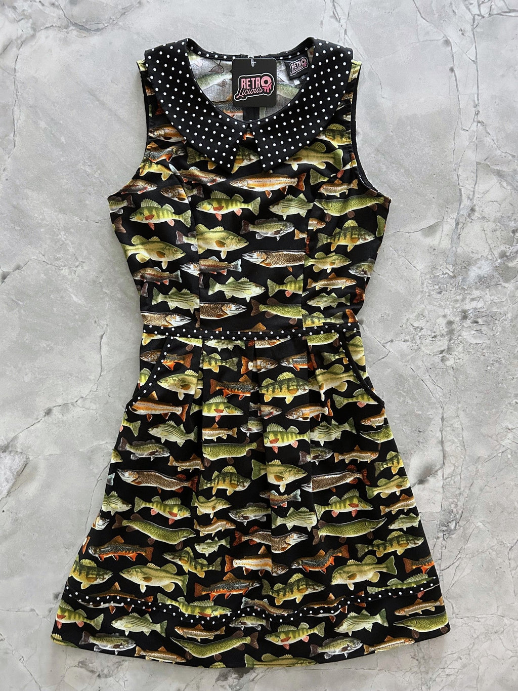 Dress with fish pattern on a gray surface