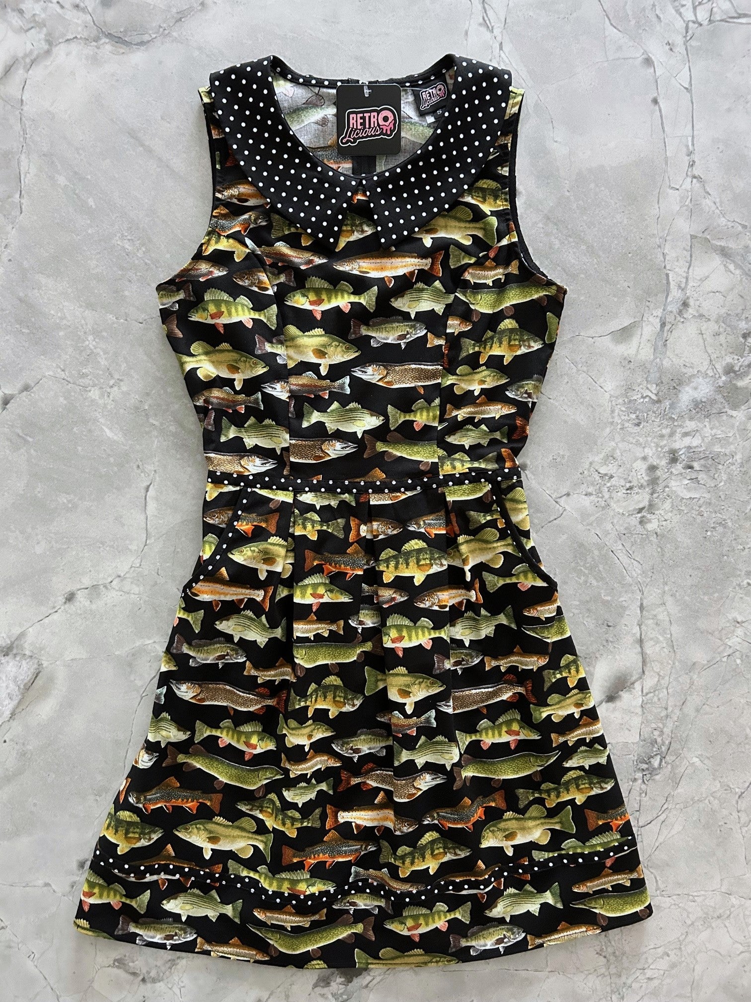 Dress with fish pattern on a gray surface
